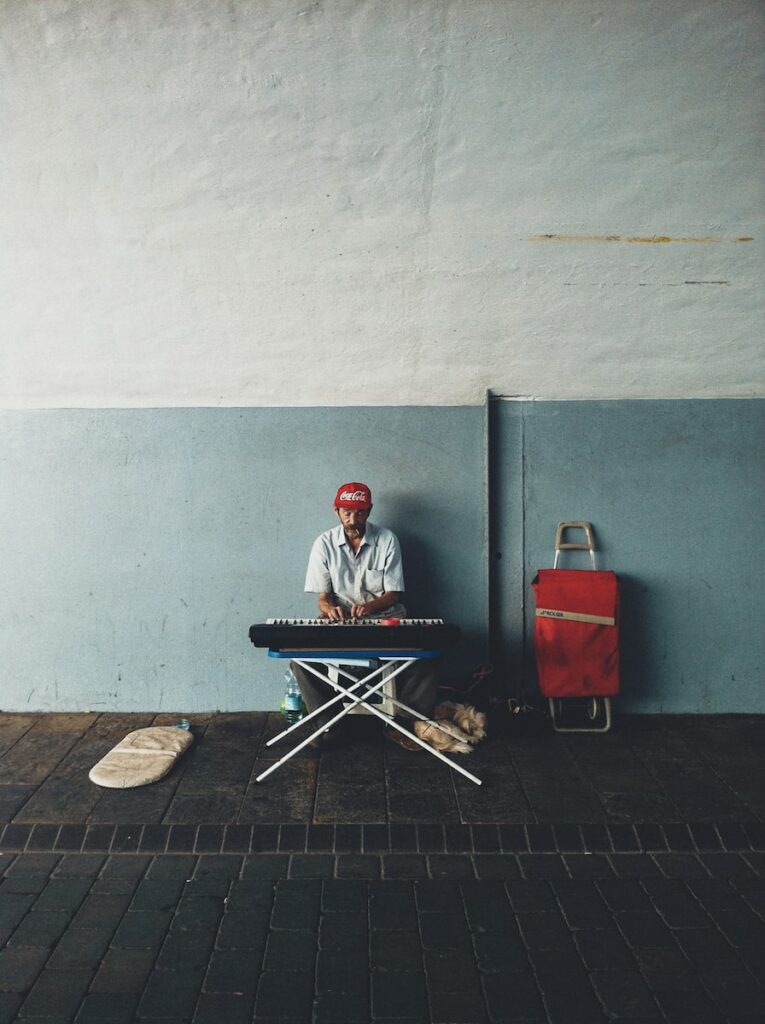Cover art of man in red jacket sitting on chair